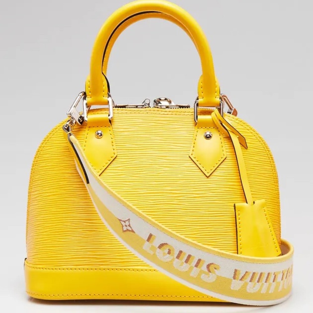 Louis Vuitton yellow Alma bb with Logo Strap